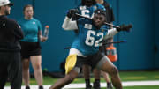 Jacksonville Jaguars offensive tackle Javon Foster (62) works out during Friday's rookie minicamp.