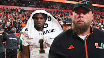 Nov 30, 2024; Syracuse, New York, USA; Miami Hurricanes quarterback Cam Ward (1) walks off the field following a game against the Syracuse Orange at the JMA Wireless Dome. Mandatory Credit: Rich Barnes-Imagn Images