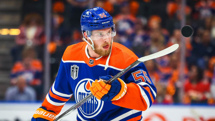 Jun 21, 2024; Edmonton, Alberta, CAN; Edmonton Oilers left wing Dylan Holloway (55) controls the puck during the warmup period against the Florida Panthers in game six of the 2024 Stanley Cup Final at Rogers Place. Mandatory Credit: Sergei Belski-USA TODAY Sports