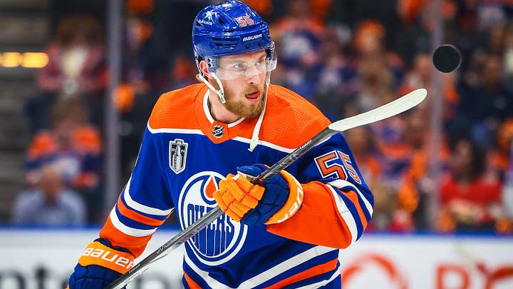 Jun 21, 2024; Edmonton, Alberta, CAN; Edmonton Oilers left wing Dylan Holloway (55) controls the puck during the warmup period against the Florida Panthers in game six of the 2024 Stanley Cup Final at Rogers Place. Mandatory Credit: Sergei Belski-Imagn Images