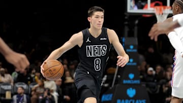 Nov 28, 2025; Brooklyn, New York, USA; Brooklyn Nets guard Egor Demin (8) controls the ball against Philadelphia 76ers guard Tyrese Maxey (0) during the third quarter at Barclays Center. Mandatory Credit: Brad Penner-Imagn Images