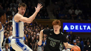 Nov 6, 2023; Durham, North Carolina, USA; Dartmouth Big Green guard Ryan Cornish (10) controls the ball in front of Duke Blue Devils center Kyle Filipowski(30) during the first half at Cameron Indoor Stadium. Mandatory Credit: Rob Kinnan-Imagn Images