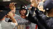 Sep 8, 2025; Anaheim, California, USA;  Minnesota Twins second baseman Luke Keaschall (15) is greeted in the dugout after scoring a run during the eighth inning against the Los Angeles Angels at Angel Stadium. Mandatory Credit: Kiyoshi Mio-Imagn Images
