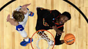 Mar 27, 2025; San Francisco, CA, USA; Maryland Terrapins center Derik Queen (25) attempts a basket against Florida Gators forward Thomas Haugh (10) in the second half during a West Regional semifinal of the 2025 NCAA tournament at Chase Center. Mandatory Credit: Eakin Howard-Imagn Images