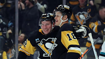 Nov 16, 2024; Pittsburgh, Pennsylvania, USA;  Pittsburgh Penguins right wing Jesse Puljujarvi (18) celebrates with right wing Sam Poulin (22) after scoring a goal against the San Jose Sharks during the first period at PPG Paints Arena. Mandatory Credit: Charles LeClaire-Imagn Images