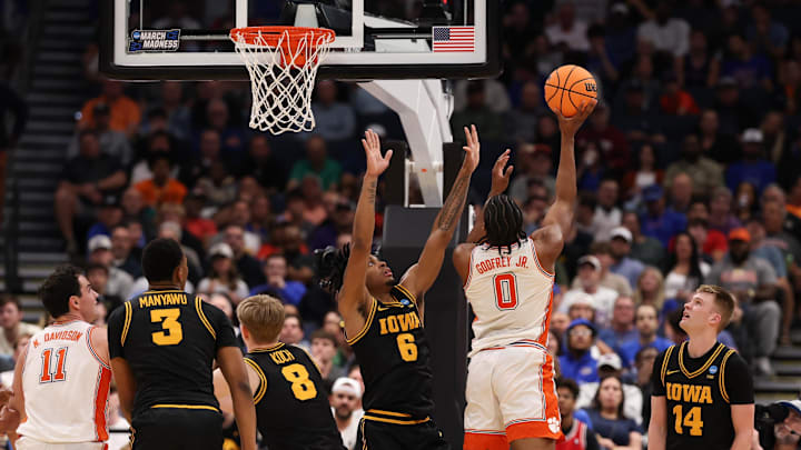 Mar 20, 2026; Tampa, FL, USA; Clemson Tigers forward RJ Godfrey (0) shoots while defended by Iowa Hawkeyes forward Tavion Banks (6) in the second half during a first round game of the men's 2026 NCAA Tournament at Benchmark International Arena. Mandatory Credit: Matt Pendleton-Imagn Images