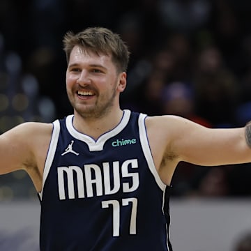 Nov 15, 2023; Washington, District of Columbia, USA; Dallas Mavericks guard Luka Doncic (77) celebrates against the Washington Wizards in the third quarter at Capital One Arena. Mandatory Credit: Geoff Burke-Imagn Images