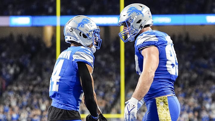 Detroit Lions tight end Brock Wright (89) celebrates a touchdown against Jacksonville Jaguars with wide receiver Amon-Ra St. Brown.
