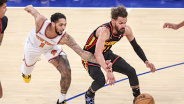 Feb 12, 2025; New York, New York, USA; New York Knicks guard Cameron Payne (1) and Atlanta Hawks guard Trae Young (11) fight for a loose ball in the fourth quarter at Madison Square Garden. Mandatory Credit: Wendell Cruz-Imagn Images