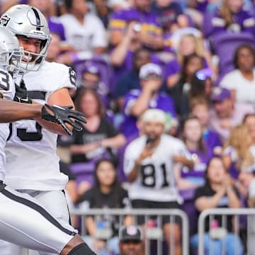 Aug 10, 2024; Minneapolis, Minnesota, USA; Las Vegas Raiders running back Zamir White (3) celebrates his touchdown against the Minnesota Vikings in the second quarter at U.S. Bank Stadium. Mandatory Credit: Brad Rempel-USA TODAY Sports