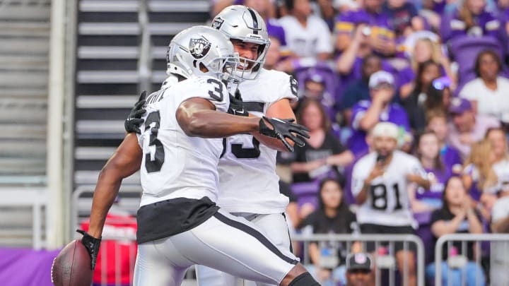 Aug 10, 2024; Minneapolis, Minnesota, USA; Las Vegas Raiders running back Zamir White (3) celebrates his touchdown against the Minnesota Vikings in the second quarter at U.S. Bank Stadium. Mandatory Credit: Brad Rempel-USA TODAY Sports