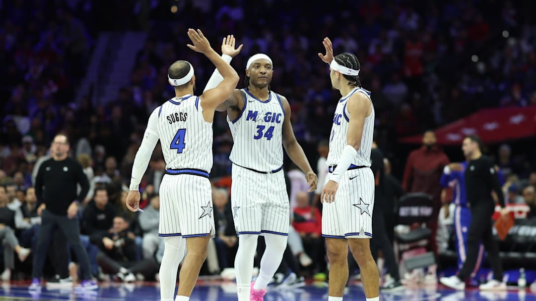 Nov 25, 2025; Philadelphia, Pennsylvania, USA; Orlando Magic guard Anthony Black (0) and center Wendell Carter Jr. (34) and guard Jalen Suggs (4) high five after a play against the Philadelphia 76ers during the second quarter at Xfinity Mobile Arena. Mandatory Credit: Bill Streicher-Imagn Images