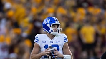 Nov 23, 2024; Tempe, Arizona, USA; Brigham Young Cougars quarterback Jake Retzlaff (12) against the Arizona State Sun Devils at Mountain America Stadium. Mandatory Credit: Mark J. Rebilas-Imagn Images