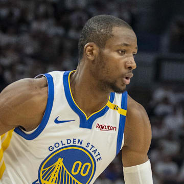 May 8, 2025; Minneapolis, Minnesota, USA; Golden State Warriors forward Jonathan Kuminga (00) dribbles the ball against the Minnesota Timberwolves in the second half during game two of the second round for the 2025 NBA Playoffs at Target Center. Mandatory Credit: Jesse Johnson-Imagn Images