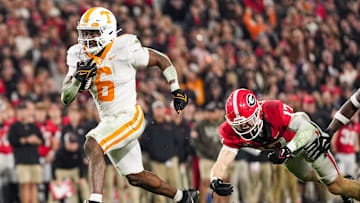 Tennessee running back Dylan Sampson (6) leaves Georgia defensive back Dan Jackson (17) behind as he strides into the end zone for a touchdown during a college football game between Tennessee and Georgia at Sanford Stadium in Athens, Ga., on Saturday, November 16, 2024.