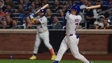 Sep 16, 2025; New York City, New York, USA; New York Mets third baseman Brett Baty (7) hits a two run home run during the first inning against the San Diego Padres at Citi Field. Mandatory Credit: Vincent Carchietta-Imagn Images