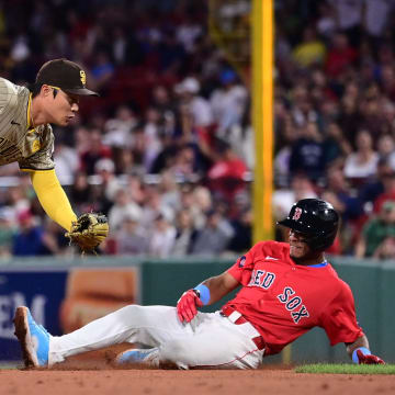 Jun 28, 2024; Boston, Massachusetts, USA; San Diego Padres shortstop Ha-Seong Kim (7) tags Boston Red Sox shortstop Ceddanne Rafaela (43) out during the seventh inning at Fenway Park.
