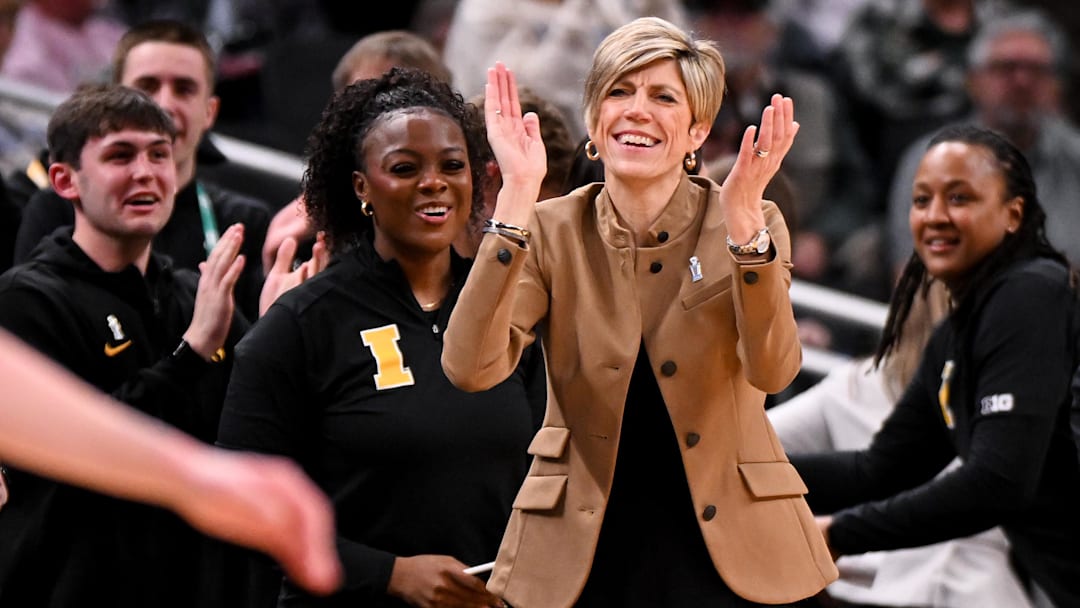 Mar 7, 2026; Indianapolis, IN, USA; Iowa Hawkeyes head coach Jan Jensen claps her hands against the Michigan Wolverines during the second half at Gainbridge Fieldhouse. Mandatory Credit: Robert Goddin-Imagn Images