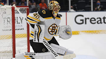 Jun 3, 2021; Uniondale, New York, USA; Boston Bruins goalie Tuukka Rask (40) plays the puck against the New York Islanders during the second period of game three of the second round of the 2021 Stanley Cup Playoffs at Nassau Veterans Memorial Coliseum. Mandatory Credit: Brad Penner-Imagn Images