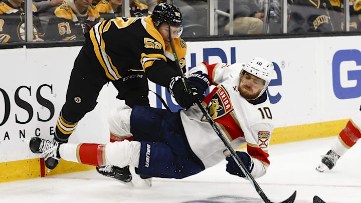 Oct 14, 2024; Boston, Massachusetts, USA; Boston Bruins defenseman Andrew Peeke (52) knocks down Florida Panthers left wing A.J. Greer (10) during the third period at TD Garden. Mandatory Credit: Winslow Townson-Imagn Images Oct 14, 2024; Boston, Massachusetts, USA; Boston Bruins defenseman Andrew Peeke (52) knocks down Florida Panthers left wing A.J. Greer (10) during the third period at TD Garden. Mandatory Credit: Winslow Townson-Imagn Images