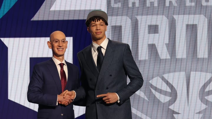 Jun 26, 2024; Brooklyn, NY, USA; Tidjane Salaun poses for photos with NBA commissioner Adam Silver after being selected in the first round by the Charlotte Hornets in the 2024 NBA Draft at Barclays Center. Mandatory Credit: Brad Penner-USA TODAY Sports