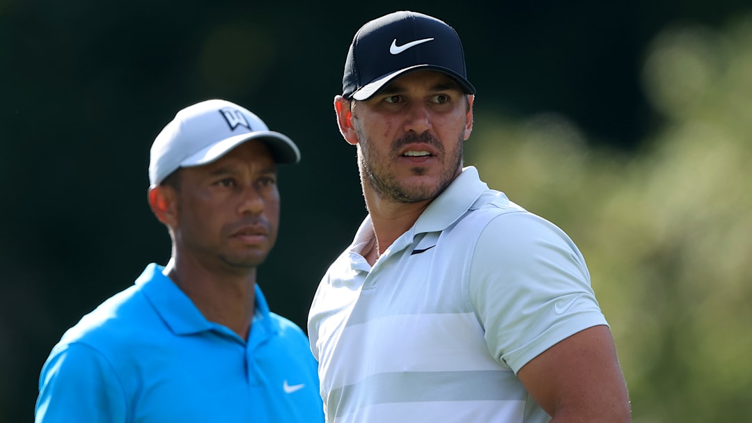 Brooks Koepka (with Tiger Woods at the 2020 Memorial Tournament) is coming back to the PGA Tour through a program that Woods helped put together.