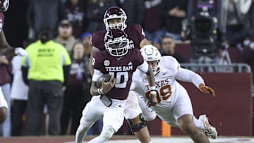 Nov 30, 2024; College Station, Texas, USA; Texas A&M Aggies quarterback Marcel Reed (10) runs with the ball during the fourth quarter against the Texas Longhorns at Kyle Field. Mandatory Credit: Troy Taormina-Imagn Images