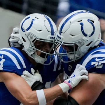 Indianapolis Colts wide receiver Alec Pierce (14) celebrates with Indianapolis Colts guard Will Fries (75) after scoring a touchdown Sunday, Sept. 8, 2024, during a game against the Houston Texans at Lucas Oil Stadium in Indianapolis.