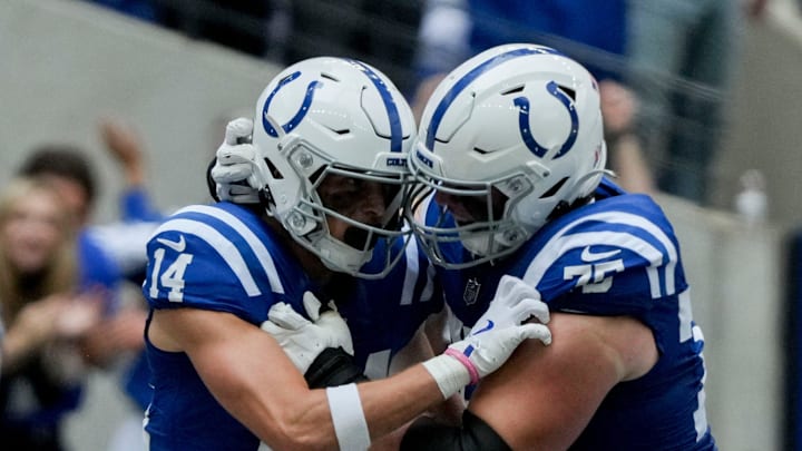 Indianapolis Colts wide receiver Alec Pierce (14) celebrates with Indianapolis Colts guard Will Fries (75) after scoring a touchdown Sunday, Sept. 8, 2024, during a game against the Houston Texans at Lucas Oil Stadium in Indianapolis.