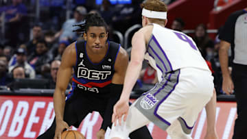 Dec 16, 2022; Detroit, Michigan, USA;  Detroit Pistons guard Jaden Ivey (23) dribbles defended by Sacramento Kings guard Kevin Huerter (9):  Rick Osentoski-Imagn Images