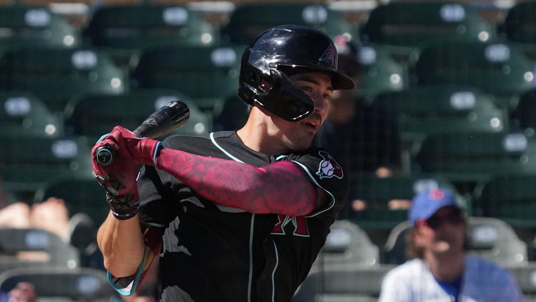 Mar 18, 2026; Salt River Pima-Maricopa, Arizona, USA; Arizona Diamondbacks right fielder Corbin Carroll (7) hits against the Chicago Cubs in the third inning at Salt River Fields at Talking Stick. Mandatory Credit: Rick Scuteri-Imagn Images