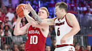 Indiana Hoosiers forward Luke Goode (10) drives to the basket as Louisville Cardinals guard Reyne Smith (6) defends during the second half at the Atlantis Resort.
