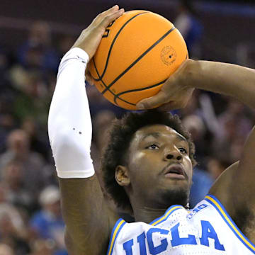 Feb 4, 2025; Los Angeles, California, USA; UCLA Bruins guard Eric Dailey Jr. (3) shoots over Michigan State Spartans forward Coen Carr (55) in the first half at Pauley Pavilion presented by Wescom. Mandatory Credit: Jayne Kamin-Oncea-Imagn Images