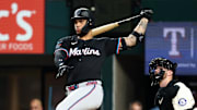 Sep 19, 2025; Arlington, Texas, USA;  Miami Marlins designated hitter Agustin Ramirez (50) hits a double during the third inning against the Texas Rangers at Globe Life Field. 