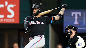 Sep 19, 2025; Arlington, Texas, USA;  Miami Marlins designated hitter Agustin Ramirez (50) hits a double during the third inning against the Texas Rangers at Globe Life Field. 