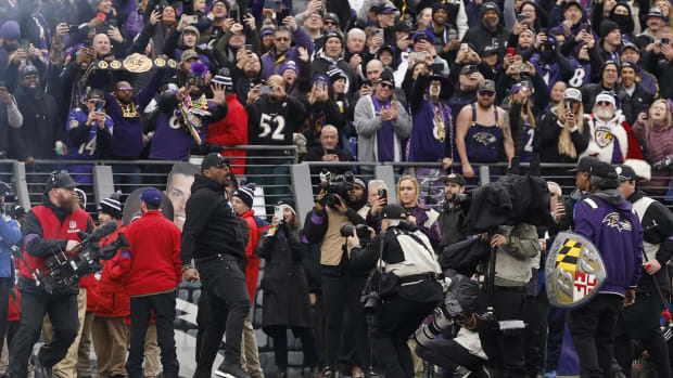 NFL Hall of Fame member and former Baltimore Ravens linebacker Ray Lewis (L) makes an appearance prior to the Ravens' game