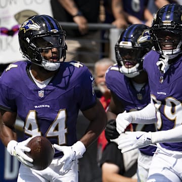 Sep 15, 2024; Baltimore, Maryland, USA;  Baltimore Ravens cornerback Marlon Humphrey (44) celebrates with teammates zaftret intercepting as Las Vegas Raiders quarterback Gardner Minshew (not pictured) pass during the first half at M&T Bank Stadium. Mandatory Credit: Tommy Gilligan-Imagn Images