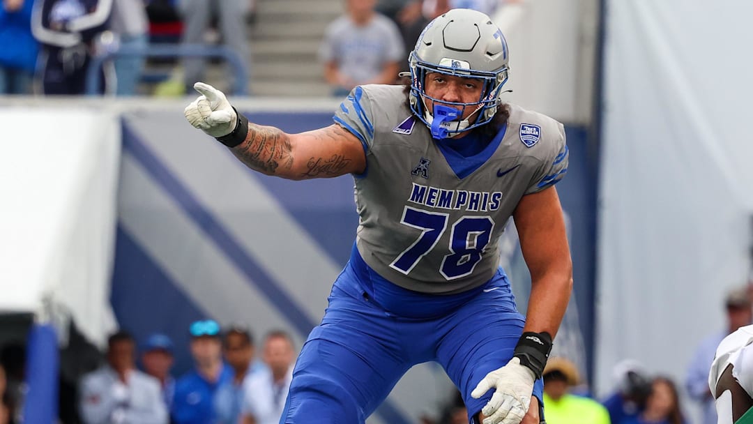 Oct 25, 2025; Memphis, Tennessee, USA; Memphis Tigers offensive lineman Travis Burke (78) gestures toward the South Florida Bulls defense on the line of scrimmage during the second half at Simmons Bank Liberty Stadium. Mandatory Credit: Wesley Hale-Imagn Images