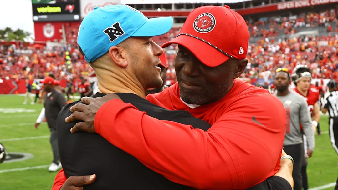 Dec 29, 2024; Tampa, Florida, USA; Tampa Bay Buccaneers head coach Todd Bowles and Carolina Panthers head coach Dave Canales Mandatory Credit: Kim Klement Neitzel-Imagn Images