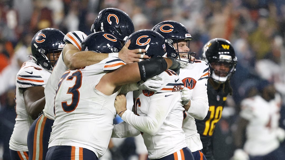 Oct 13, 2025; Landover, Maryland, USA; Chicago Bears kicker Jake Moody (16) celebrates with teammates after kicking a game-winning field goal against the Washington Commanders during the fourth quarter at Northwest Stadium. Mandatory Credit: Geoff Burke-Imagn Images