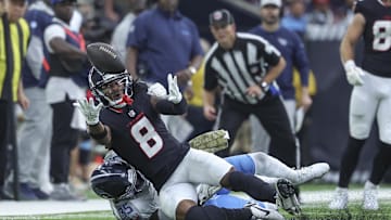 Nov 24, 2024; Houston, Texas, USA; Houston Texans wide receiver John Metchie III (8) is unable to make a reception as Tennessee Titans cornerback Daryl Worley (35) defends during the fourth quarter at NRG Stadium. Mandatory Credit: Troy Taormina-Imagn Images