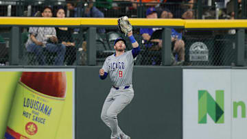 Sep 13, 2024; Denver, Colorado, USA; Chicago Cubs left fielder Ian Happ (8) makes a catch in the third inning against the Colorado Rockies at Coors Field. 