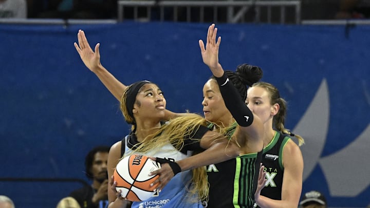 Jul 14, 2025; Chicago, Illinois, USA;  Chicago Sky forward Angel Reese (5) drives to the basket against Minnesota Lynx forward Alanna Smith (8) and forward Napheesa Collier (24)  defends against Minnesota Lynx forward Jessica Shepard (15) during the first half at Wintrust Arena. Mandatory Credit: Matt Marton-Imagn Images