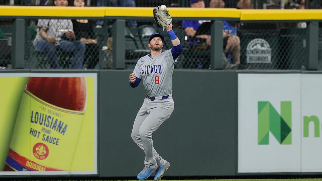 Sep 13, 2024; Denver, Colorado, USA; Chicago Cubs left fielder Ian Happ (8) makes a catch in the third inning against the Colorado Rockies at Coors Field.