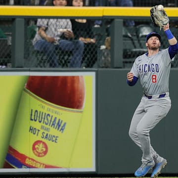 Sep 13, 2024; Denver, Colorado, USA; Chicago Cubs left fielder Ian Happ (8) makes a catch in the third inning against the Colorado Rockies at Coors Field.