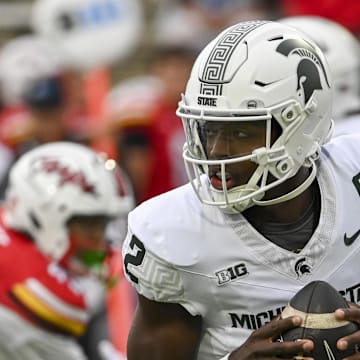 Sep 7, 2024; College Park, Maryland, USA;  Michigan State Spartans quarterback Aidan Chiles (2) rolls out to pass during the first quarter against the Maryland Terrapins  at SECU Stadium. Mandatory Credit: Tommy Gilligan-Imagn Images