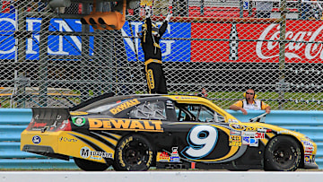 Aug 12, 2012; Watkins Glen, NY, USA; NASCAR Sprint Cup Series driver Marcos Ambrose (9) celebrates winning the Finger Lakes 335 at The Glen at Watkins Glen International.