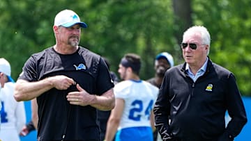 Detroit Lions head coach Dan Campbell, left, talks to president Rod Wood after practice during OTA at Meijer Performance Center in Allen Park on Friday, May 30, 2025.