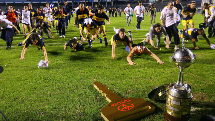 Boca Juniors players jubilate after defe...
