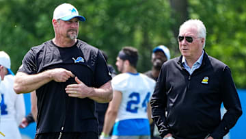Detroit Lions head coach Dan Campbell, left, talks to president Rod Wood after practice during OTA at Meijer Performance Center in Allen Park on Friday, May 30, 2025.